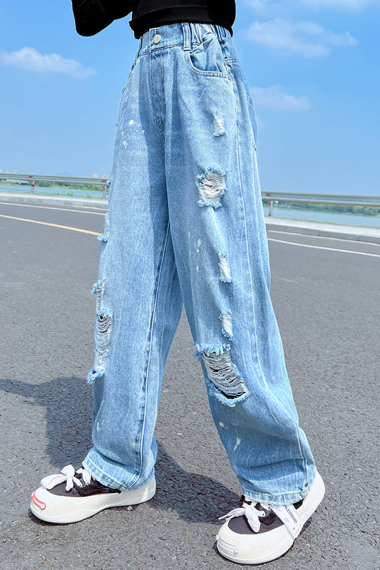 Jeans decorati con vernice strappata da ragazza 
